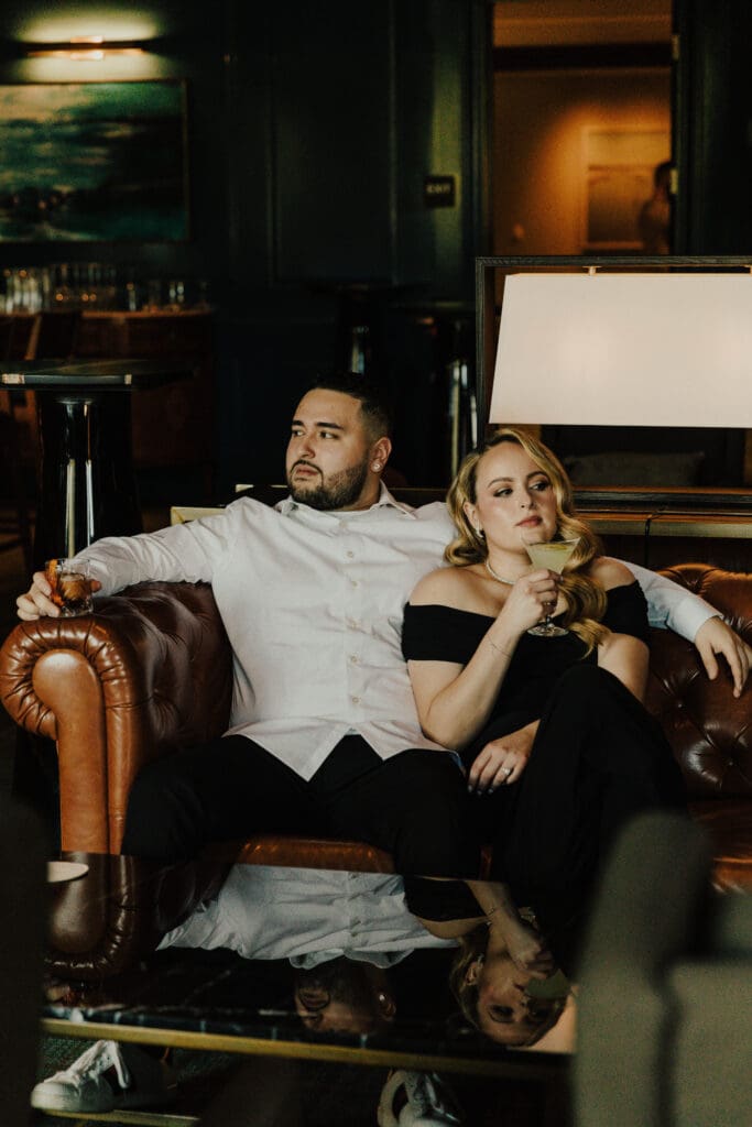 man and woman pose for engagement photos